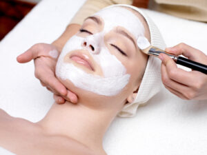 Woman receiving facial mask for European Facial